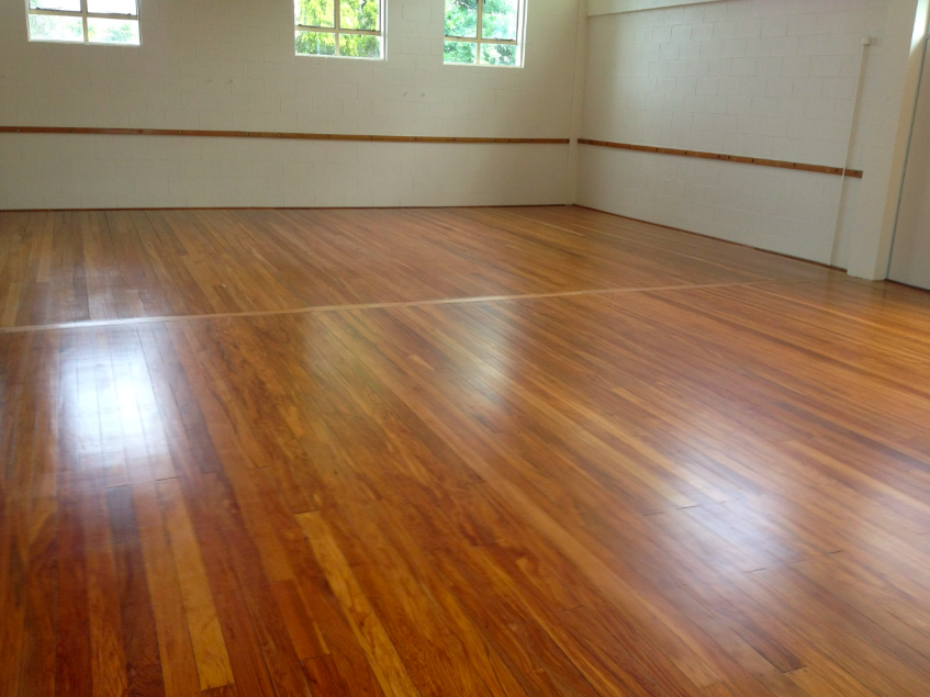 Warm honey-toned timber floor after floor sanding and polishing in Auckland