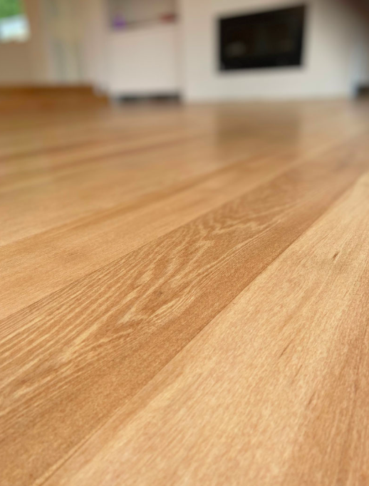 Close-up of freshly refinished oak floorboards in a West Auckland home