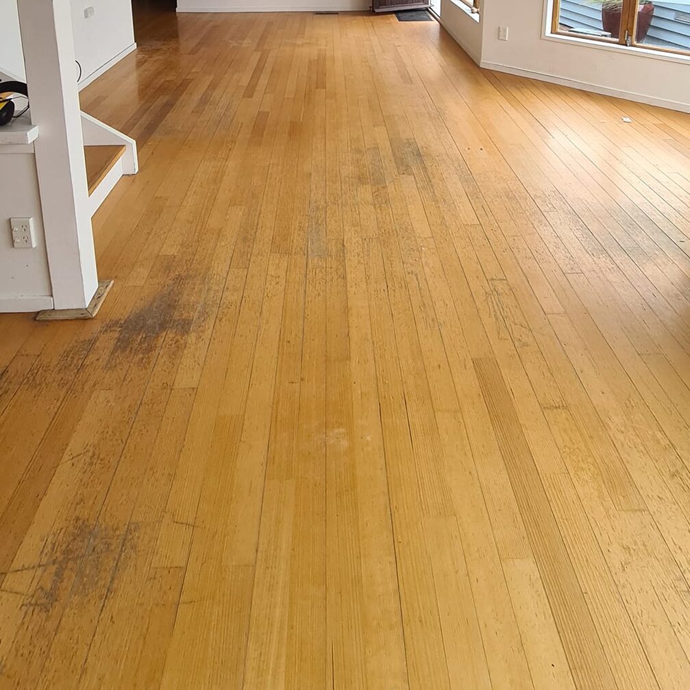 Worn timber floorboards before sanding